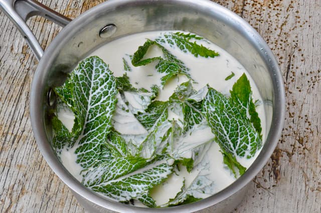 A pan of mint leaves and cream.