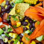 Close up of a bowl of Mexican black bean and corn salad.