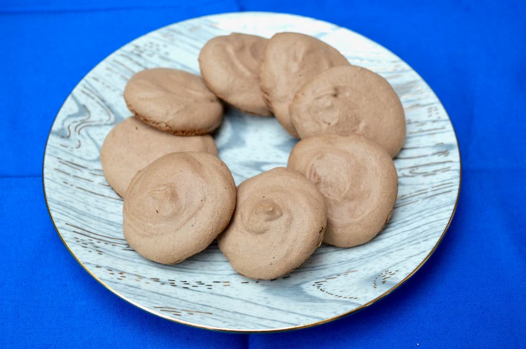 A plate of eight unfilled tiger nut flour biscuits.