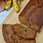Three slices from a loaf of muscovado banana bread. And a couple of bananas at the back.