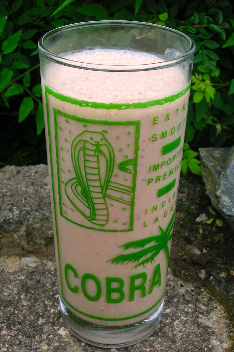 Raw cacao energiser smoothie in a large cobra glass.