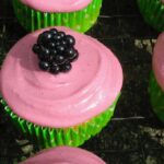 Blackberry and apple cupcakes, with only one in full view.