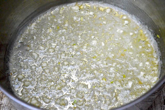 Finely chopped garlic sizzling in hot butter.