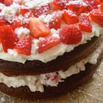 Eton Mess chocolate cake with strawberries, cream and meringue.