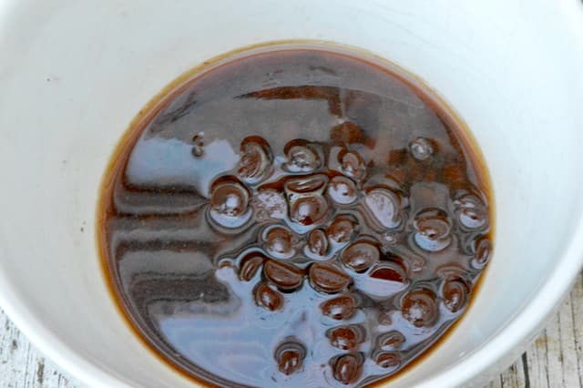 A bowl of choc chips with hot Champagne poured over the top.