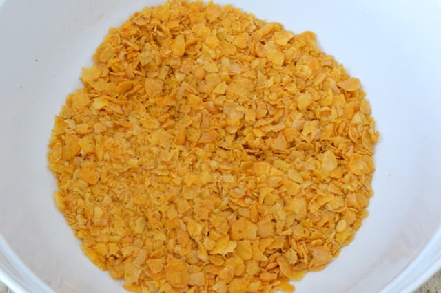 A bowl of roughly crushed cornflakes.