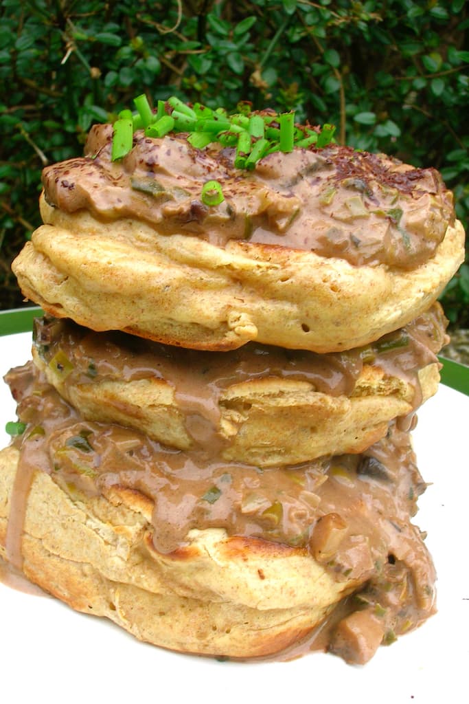 A stack of homemade crempogau (Welsh pancakes) topped with leek and mushroom chocolate sauce.