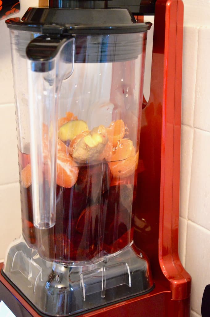 Chunks of beetroot, orange and ginger in a blender.