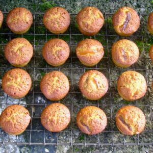 Mini matcha marmalade cakes cooling on a wire rack.
