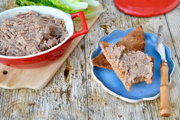 Vegan mushroom pâté on toast with a dish of pâté to the side.