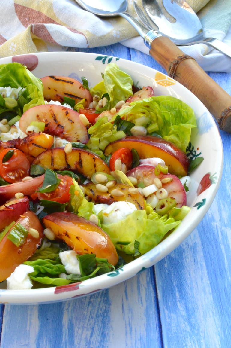 Partial view of a bowl of griddled nectarine salad.