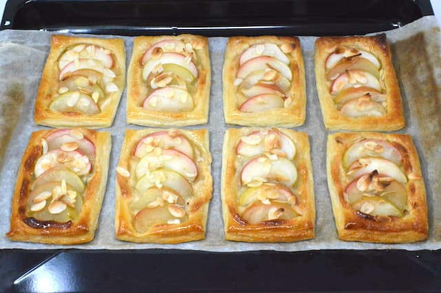 Eight apple tarts just out of oven.