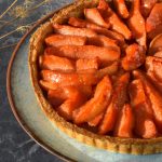 Half a quince tart in a homemade wholemeal pastry case.