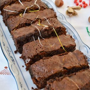 A line of festive mincemeat brownies on a plate.