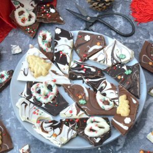 A plate of festive swirled chocolate bark pieces.