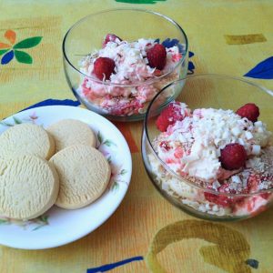 Two bowls of Scottish cranachan with plate of Highland shortbread.