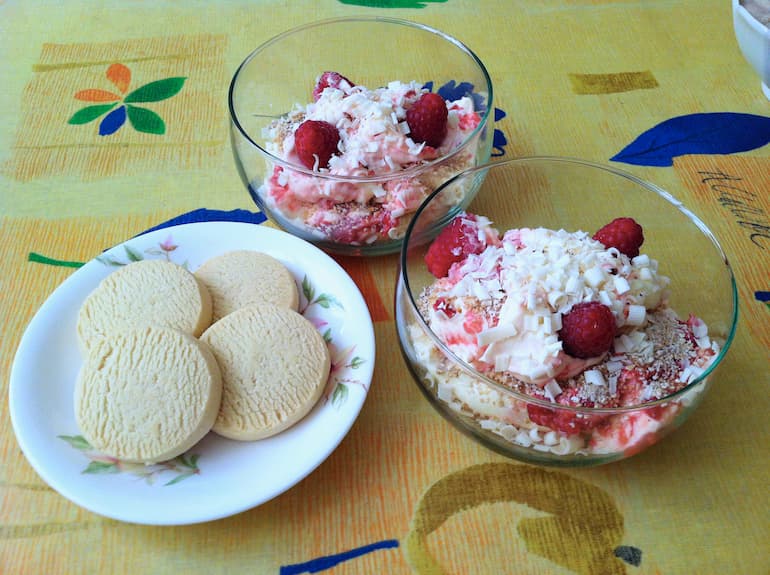 Two bowls of Scottish cranachan with plate of Highland shortbread.