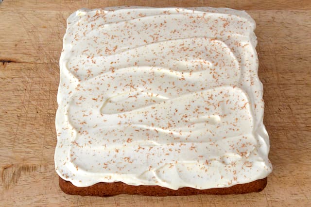 Cream cheese frosting dusted with a little grated chocolate.