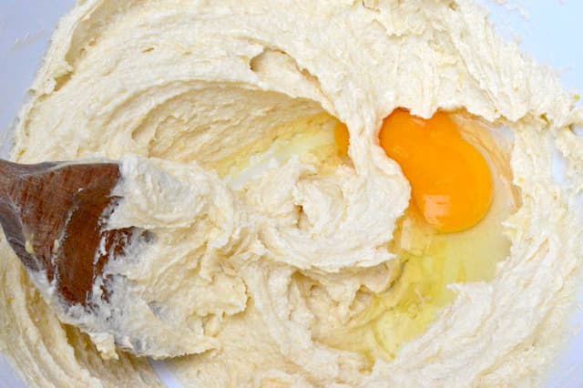Egg added to batter in bowl.