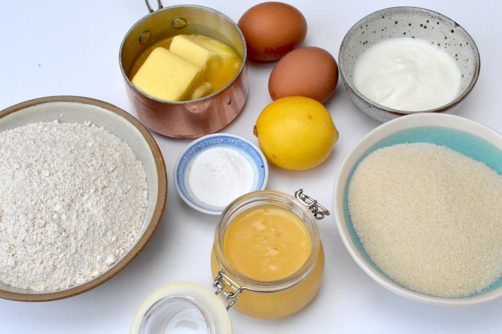 Ingredients needed to make a simple lemon curd cake.