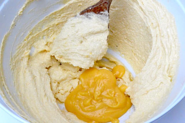 Grapefruit curd added to mixing bowl.