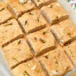Wholemeal focaccia bread cut into squares.