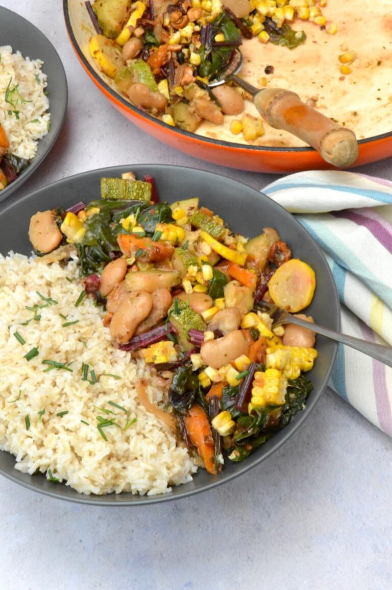A bowl of brown rice with butter beans, courgettes and sweetcorn.