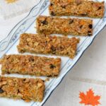 Five carrot cake flapjacks on rectangular platter.
