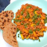 Courgette and baked beans with salsa verde on top.