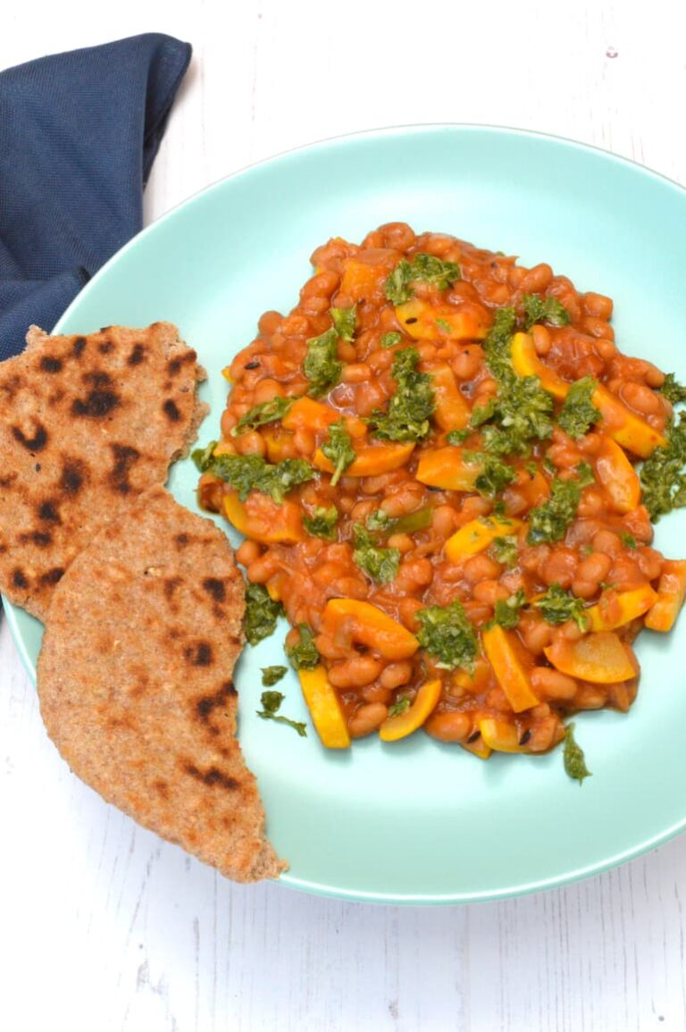 Courgette and baked beans with salsa verde on top.