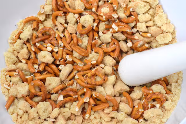 Shortbread and pretzels bashed to pieces with a pestle.