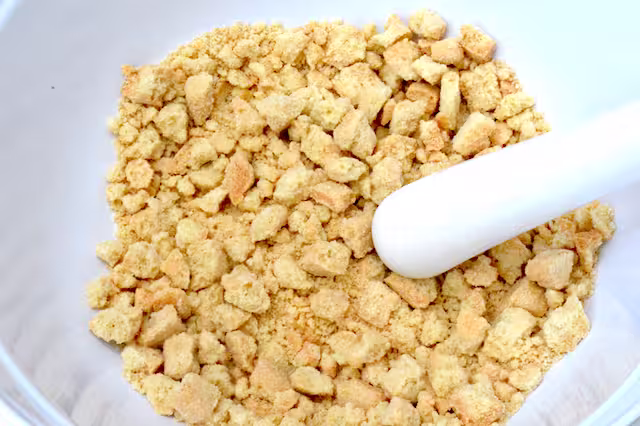 Shortbread bashed into rough crumbs with pestle.