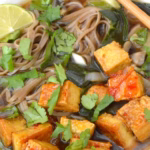 Bowl of vegan mushroom noodle soup close up.