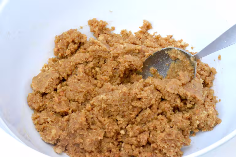 Biscuit crumbs and butter mixed.