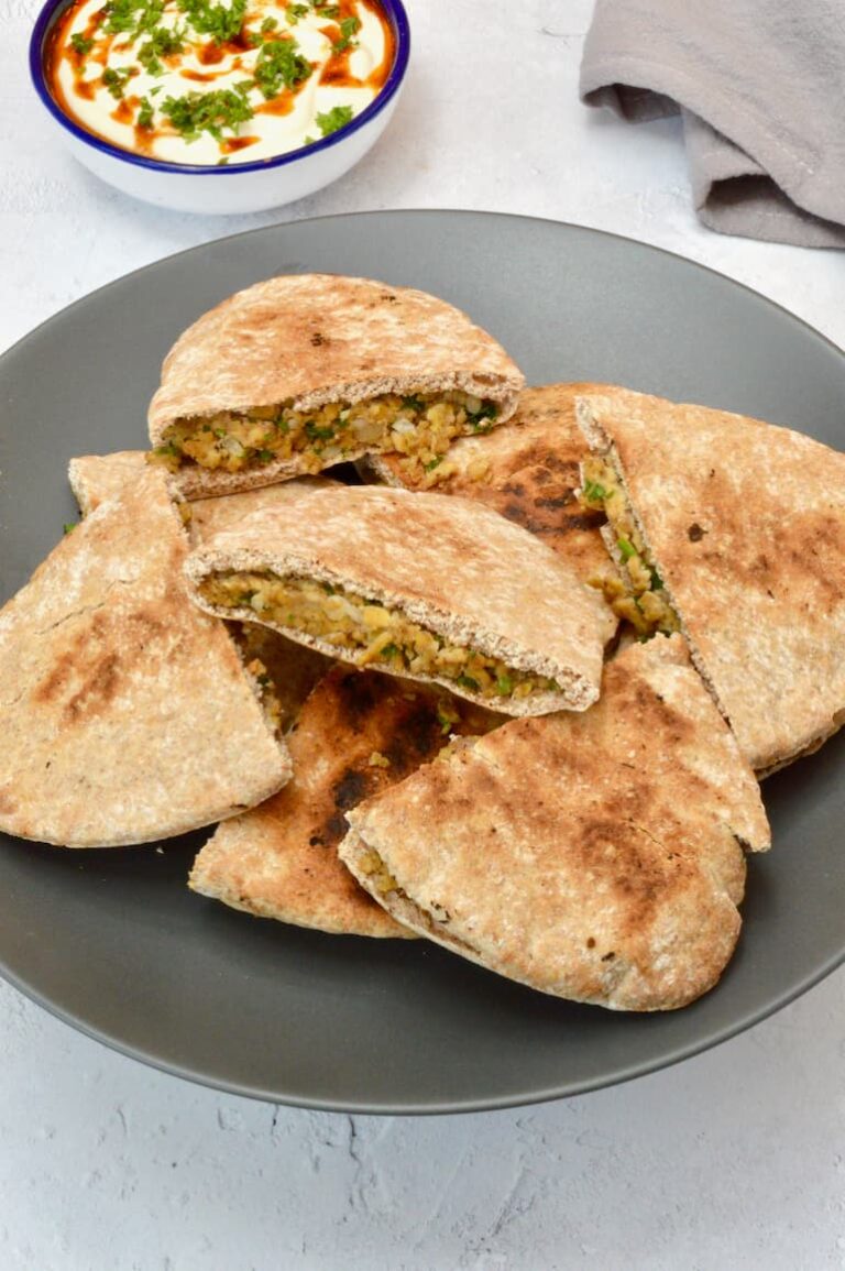 Vegan arayes, made with wholemeal pitta pockets, piled up on a plate
