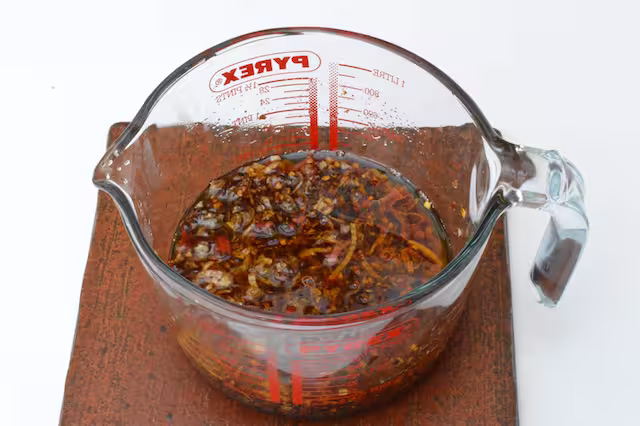 Crispy chilli oil in heatproof jug.