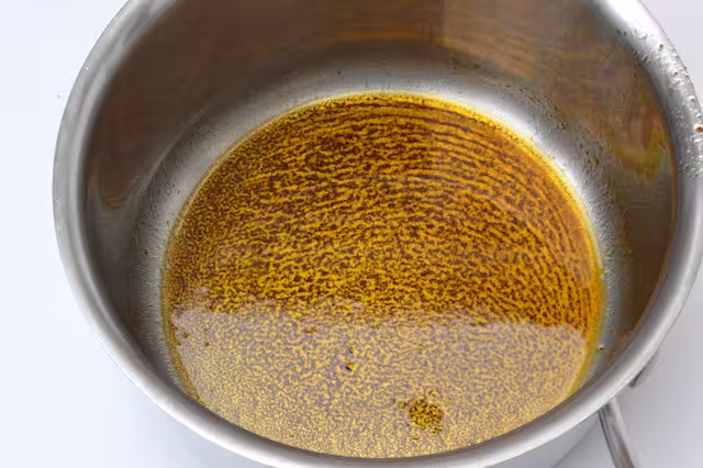Bloomed smoked paprika in olive oil.
