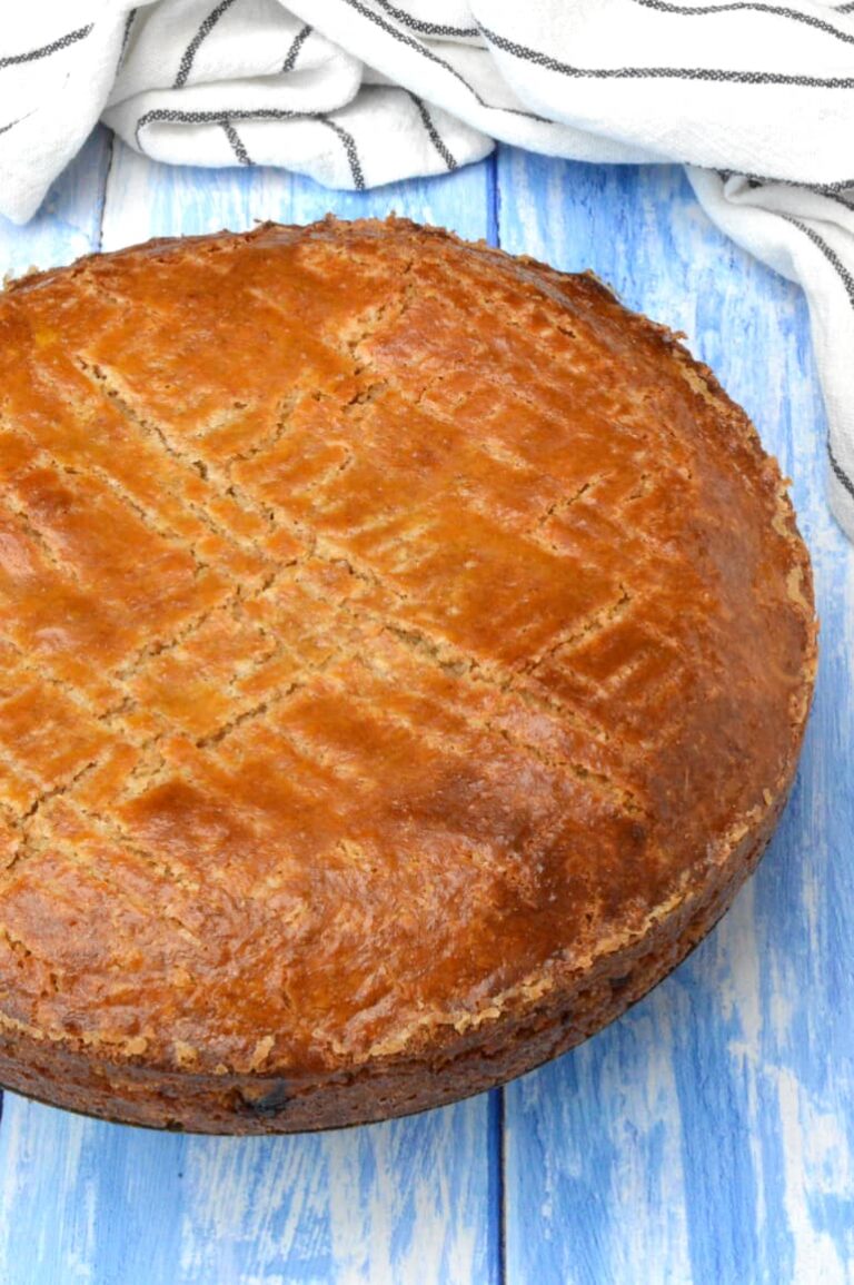 Homemade wholemeal gâteau Breton on blue board.