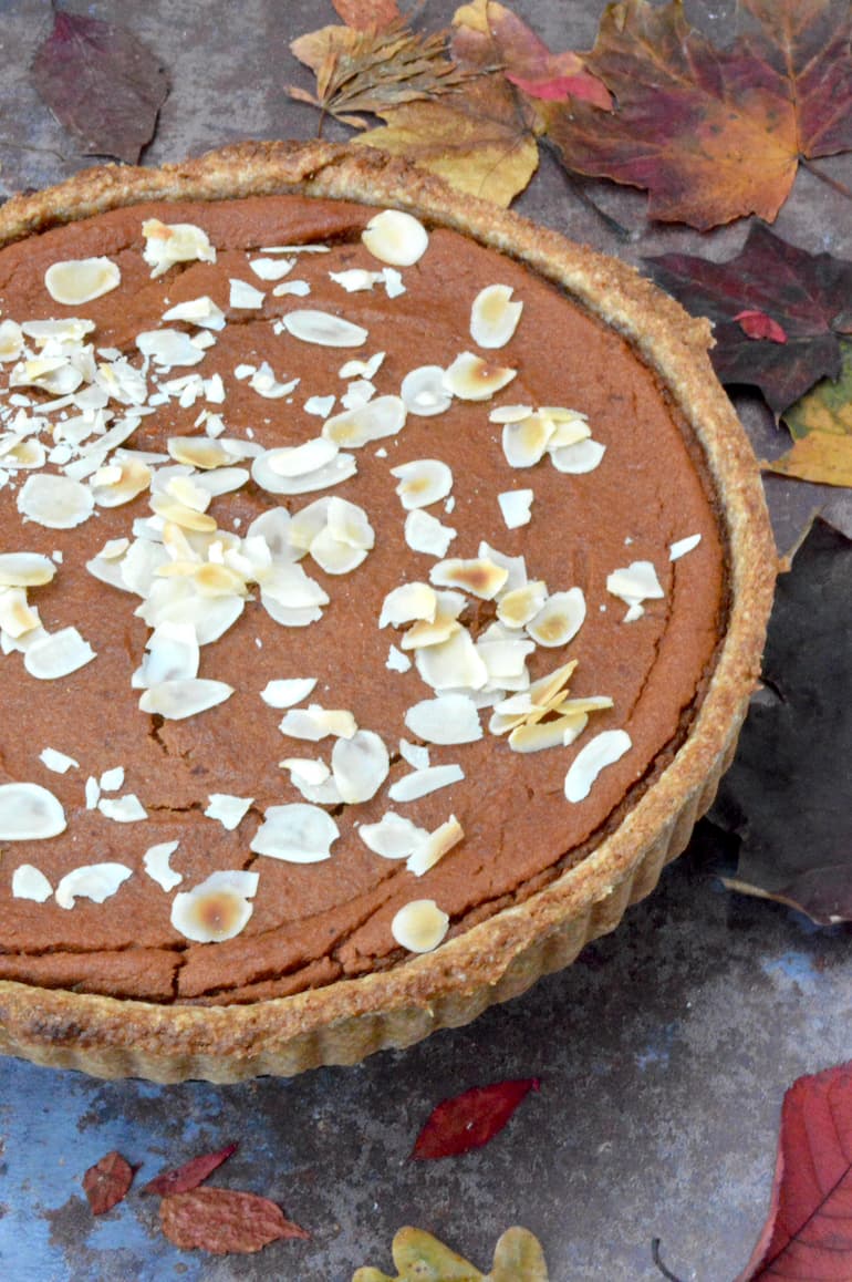 Medlar tart made with wholemeal pastry and topped with flaked almonds.