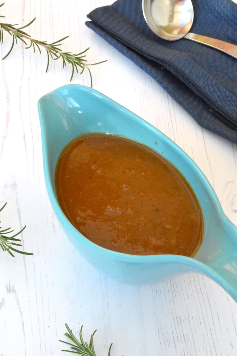 Homemade vegetarian gravy in turquoise gravy boat.
