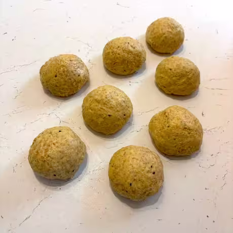 Eight balls of paratha dough.