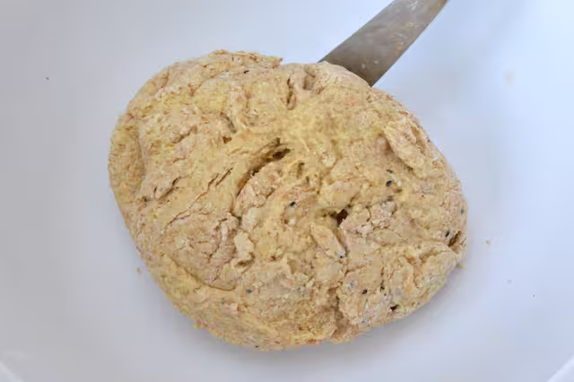 Dough brought together with knife.