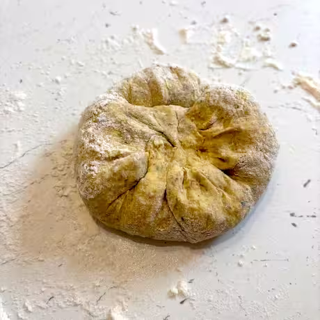 Dough enclosing stuffing.