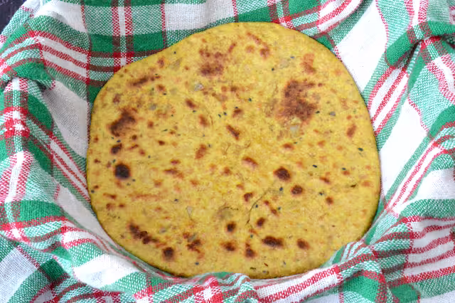 Vegan keema paratha in clothed lined basket.