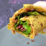 Plant-based keema paratha rolled up with lettuce, pickled red cabbage and leftover vegan mince.
