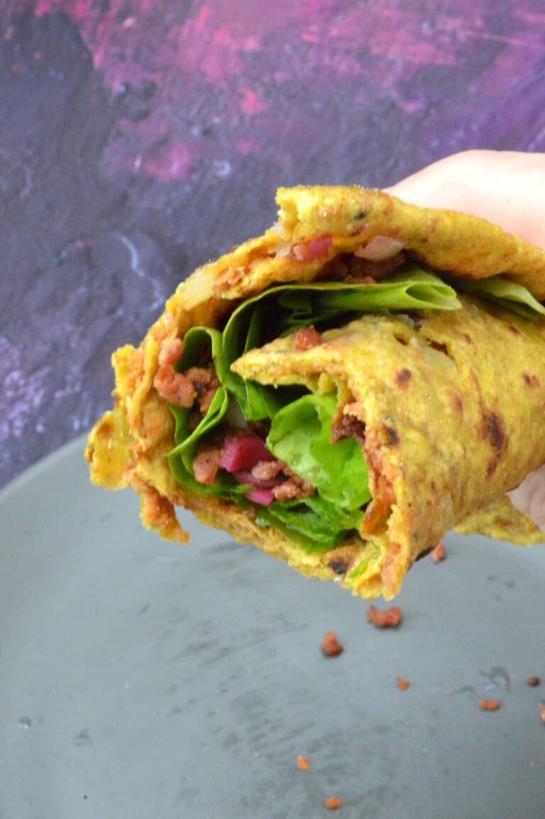 Plant-based keema paratha rolled up with lettuce, pickled red cabbage and leftover vegan mince.