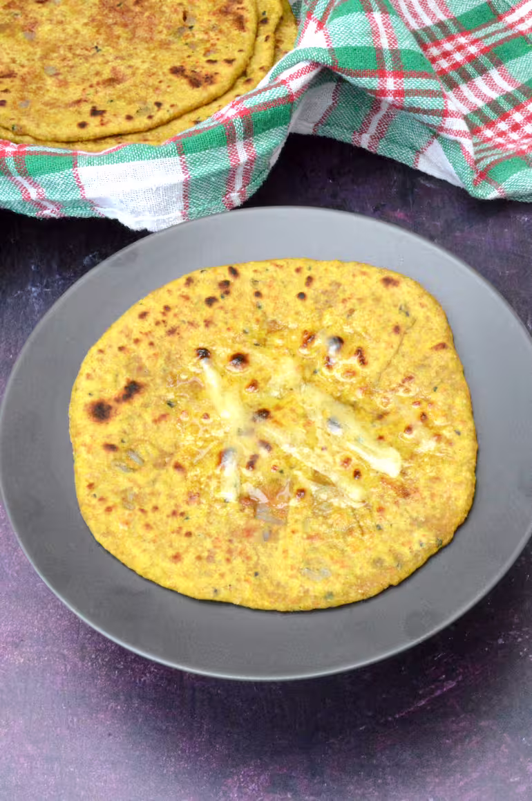 Warm plant-based keema paratha with vegan butter melting on top.