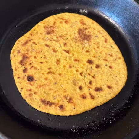 Finished baked vegan keema paratha in cast iron skillet.