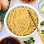 Close up of homemade vegan fish pâté with other Portuguese couvert items.