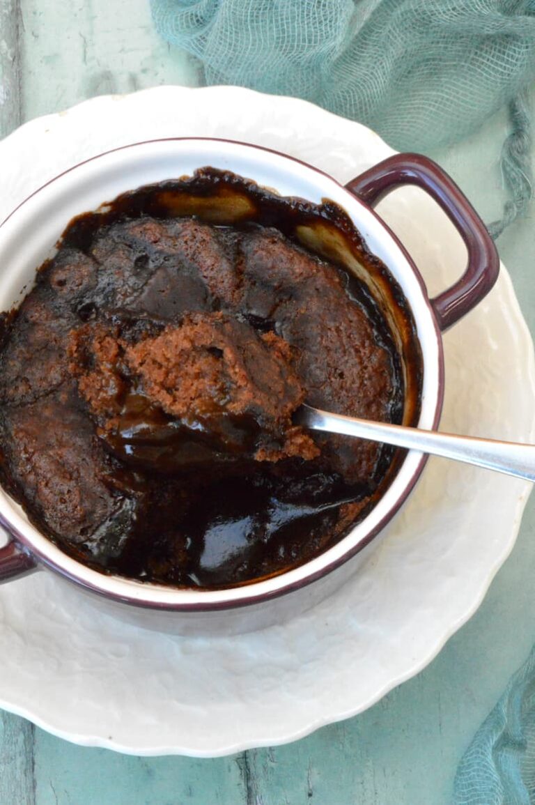 Spoonful of sponge being removed from vegan chocolate self-saucing pudding.